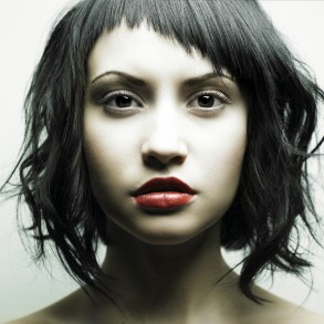 Young beautiful woman with strict hairstyle